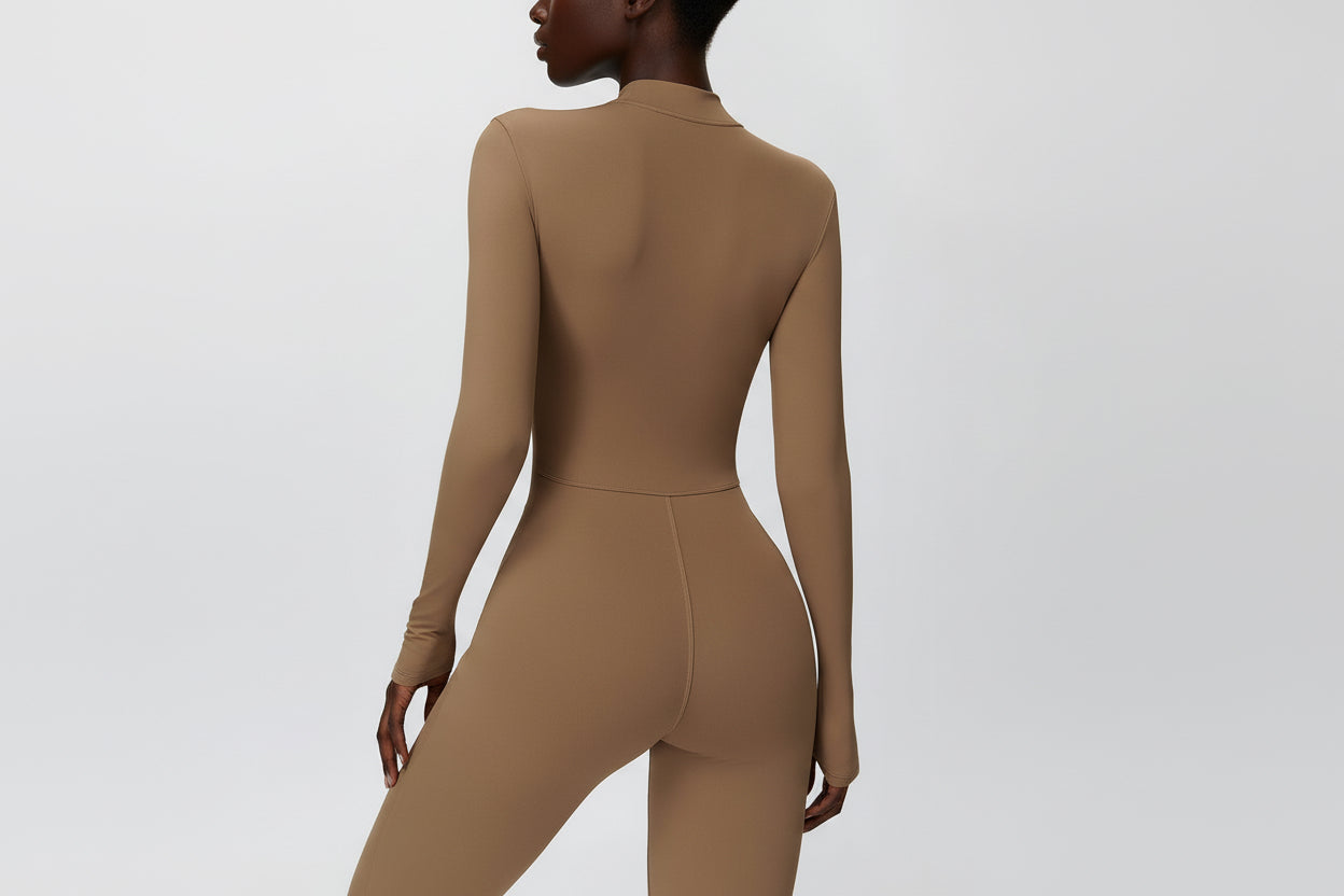Autumn–winter fleece jumpsuit with a sleek, sculpted silhouette and an elevated wide‑leg finish.