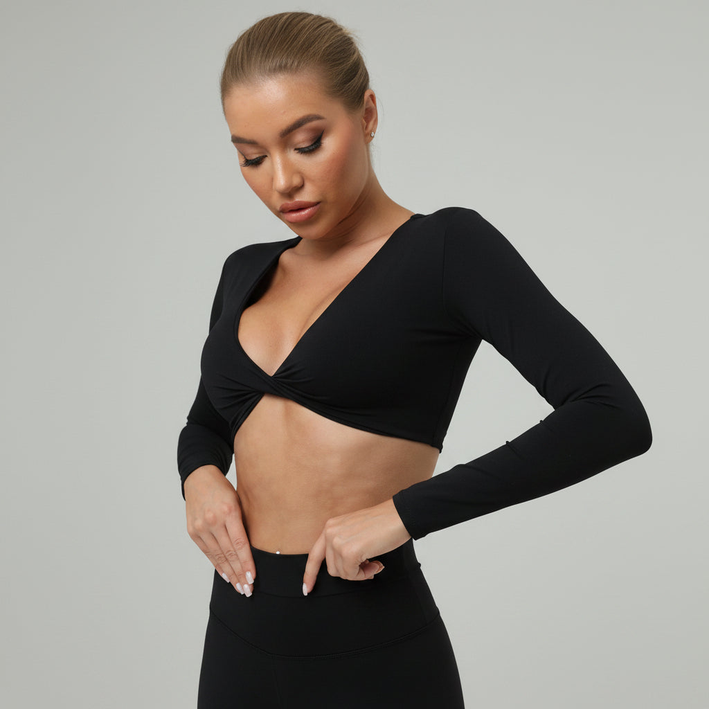 Soft-touch, long‑sleeve performance top with a chic front knot for effortless studio style.