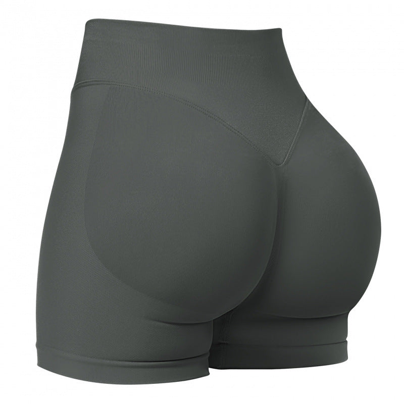 High‑waisted, seamless 3″ yoga shorts with a sculpted, peach‑lift fit and quick‑dry performance for running and training.