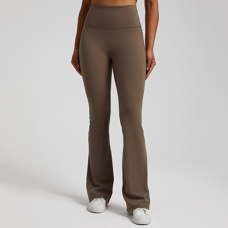 High‑waisted, sculpting wide‑leg yoga pants with a smooth, flared fit and a subtle peach‑lift silhouette.