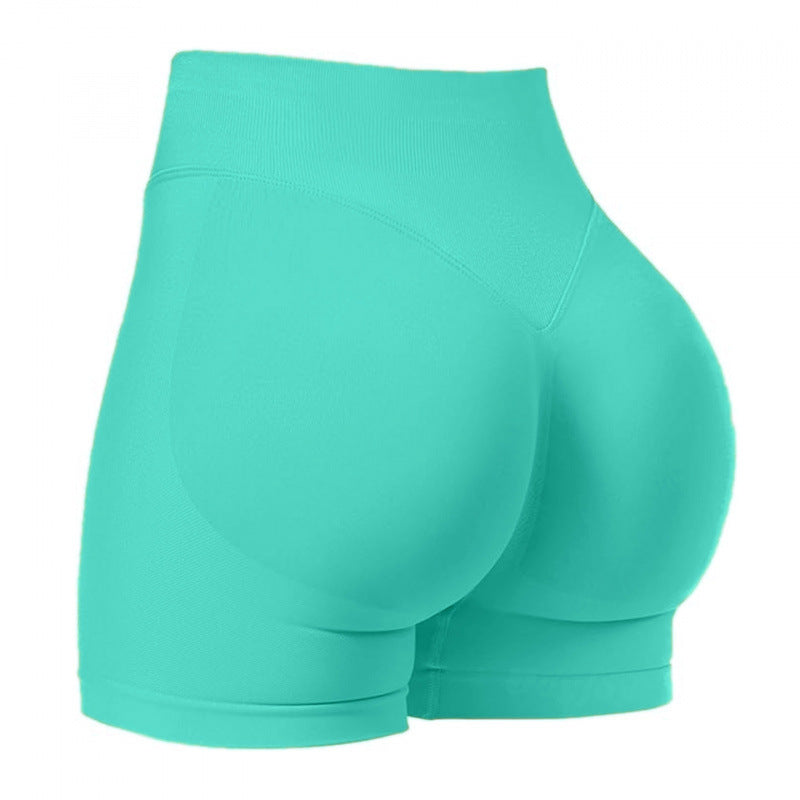 High‑waisted, seamless 3″ yoga shorts with a sculpted, peach‑lift fit and quick‑dry performance for running and training.