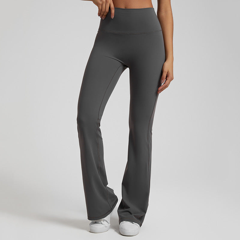 High‑waisted, sculpting wide‑leg yoga pants with a smooth, flared fit and a subtle peach‑lift silhouette.