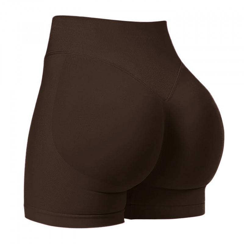 High‑waisted, seamless 3″ yoga shorts with a sculpted, peach‑lift fit and quick‑dry performance for running and training.