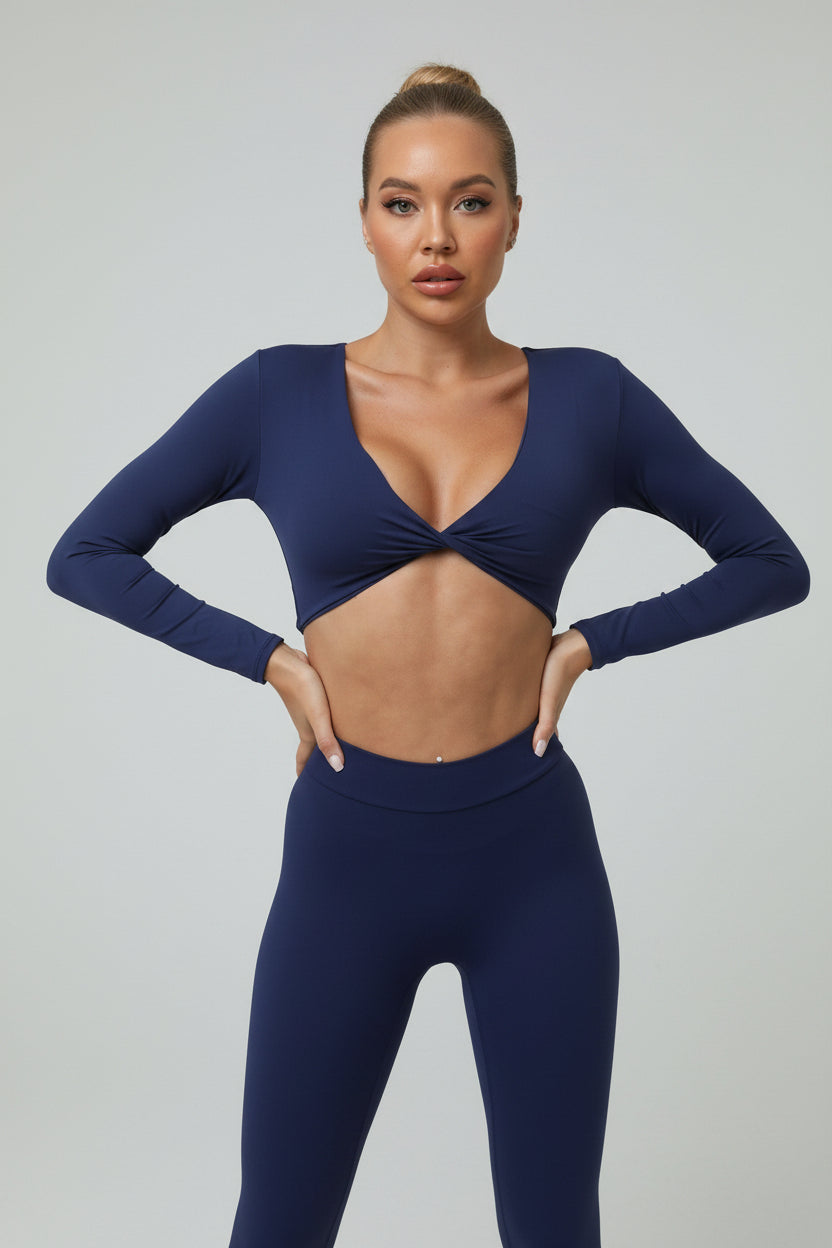 Soft-touch, long‑sleeve performance top with a chic front knot for effortless studio style.