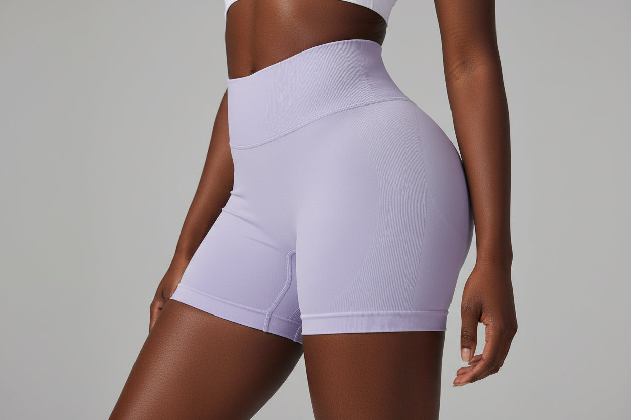 High‑waisted, seamless 3″ yoga shorts with a sculpted, peach‑lift fit and quick‑dry performance for running and training.