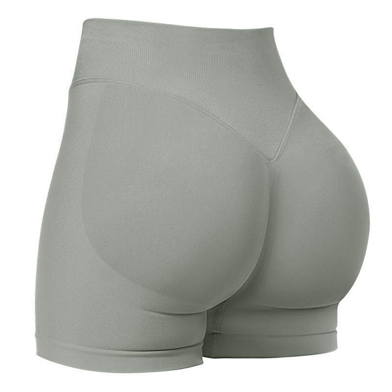 High‑waisted, seamless 3″ yoga shorts with a sculpted, peach‑lift fit and quick‑dry performance for running and training.