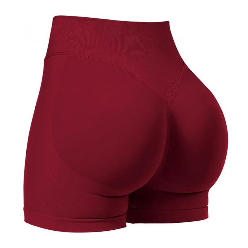 High‑waisted, seamless 3″ yoga shorts with a sculpted, peach‑lift fit and quick‑dry performance for running and training.