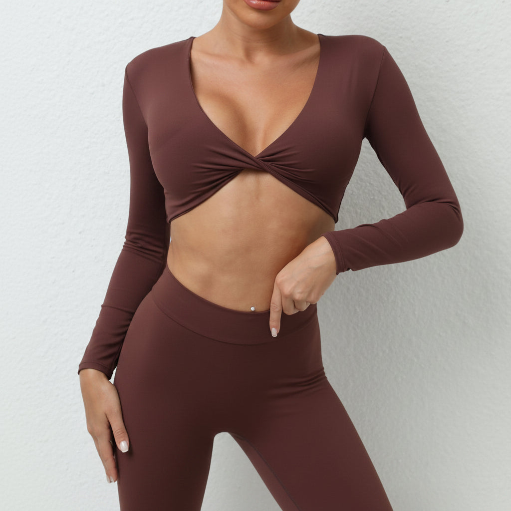 Soft-touch, long‑sleeve performance top with a chic front knot for effortless studio style.