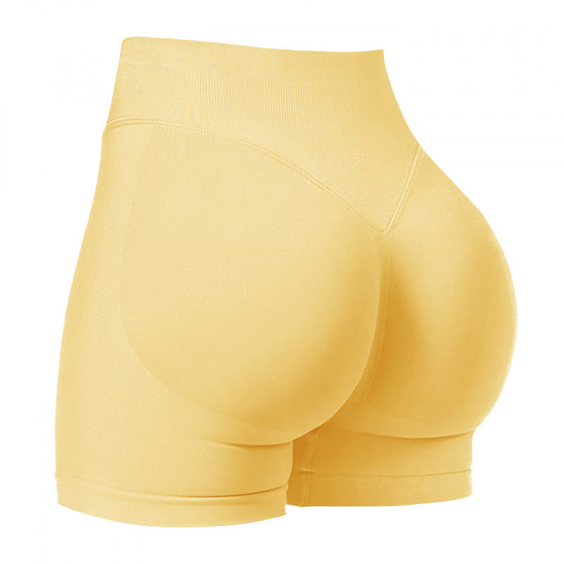 High‑waisted, seamless 3″ yoga shorts with a sculpted, peach‑lift fit and quick‑dry performance for running and training.