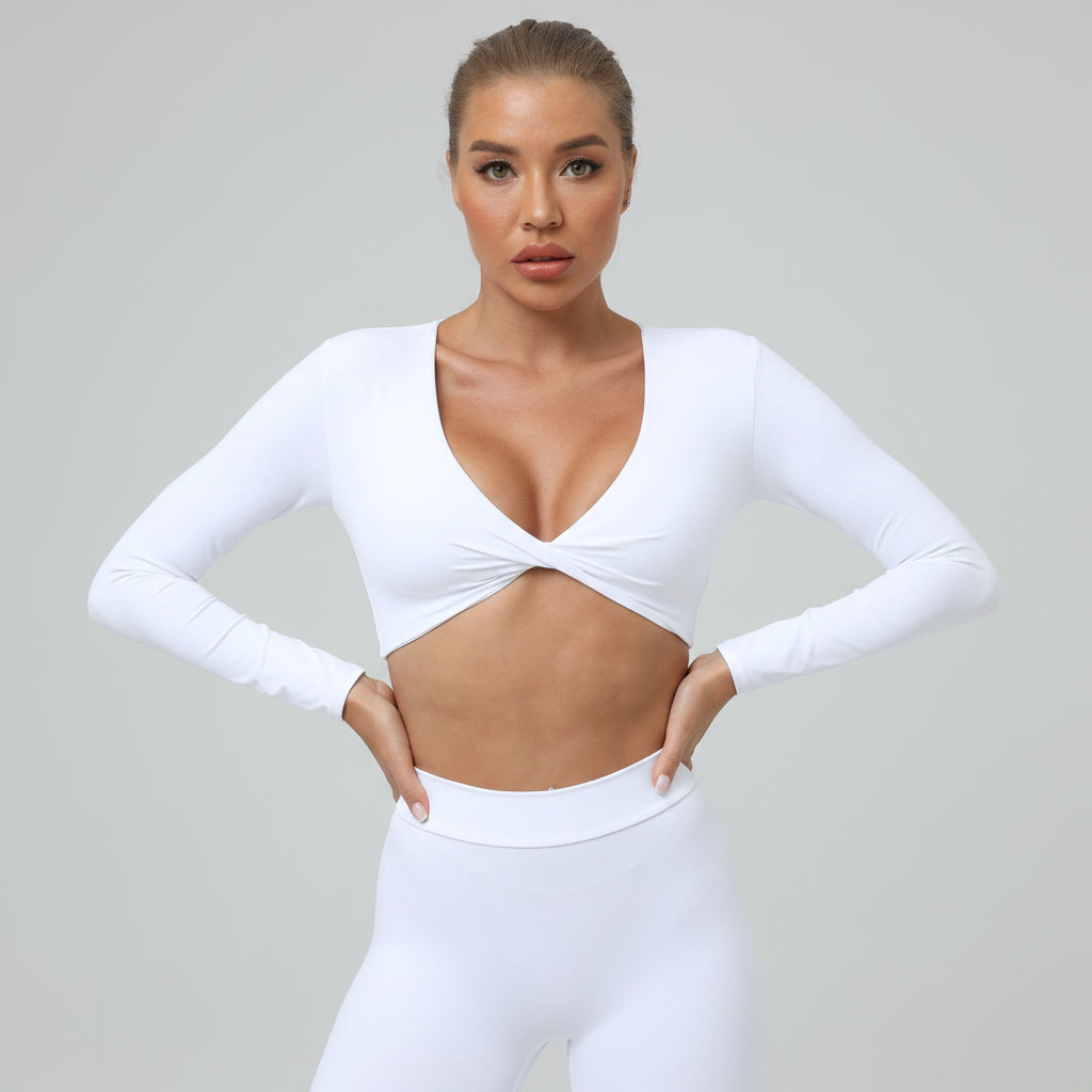 Soft-touch, long‑sleeve performance top with a chic front knot for effortless studio style.